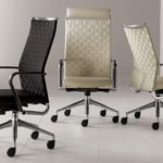 image shows 3 Body Webb Back chairs 2 in a cream or off white color and one charcoal color.