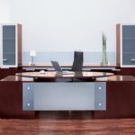 Image is of a Vestrada 0070 desk in front of a large window in an office.