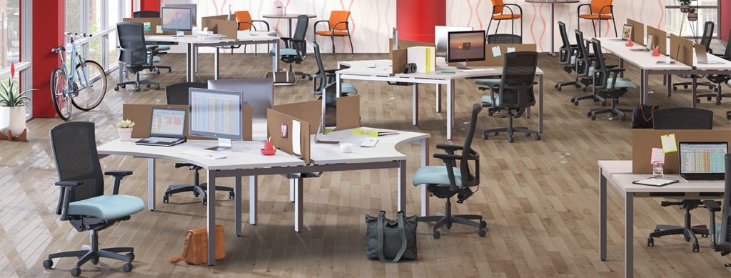 Image is of maxon Smartspace_4 with shows an open collaborative workspace that allows 3 desks to be in one spot.